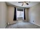 Bedroom with carpet, window, dark curtains, and neutral color walls at 11004 Napa Ridge Dr, Las Vegas, NV 89144