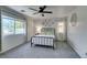 The bedroom boasts neutral tones, a ceiling fan and carpet floors, offering a serene retreat within the home at 11004 Napa Ridge Dr, Las Vegas, NV 89144