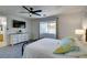 Comfortable bedroom featuring a ceiling fan and a flat screen tv for an enhanced entertainment experience at 11004 Napa Ridge Dr, Las Vegas, NV 89144