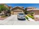 Charming single-Gathering home with a well-maintained front yard and a two-car garage at 11004 Napa Ridge Dr, Las Vegas, NV 89144