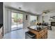Well lit kitchen with stainless steel appliances, granite counters, kitchen island and light wood cabinets at 11004 Napa Ridge Dr, Las Vegas, NV 89144