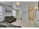 Inviting living space featuring tile floors, neutral walls, and a relaxing reclining sofa at 11004 Napa Ridge Dr, Las Vegas, NV 89144