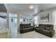 Spacious living room with tile floors, stylish decor, and a comfortable reclining sofa at 11004 Napa Ridge Dr, Las Vegas, NV 89144