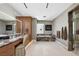 This primary bathroom boasts wood cabinets, marble countertops, a soaking tub and a glass shower at 11707 Discovery Canyon Dr, Las Vegas, NV 89135