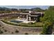 Aerial view of the modern property with a pool, patio, and landscaped backyard at 11707 Discovery Canyon Dr, Las Vegas, NV 89135