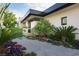 Modern home featuring manicured landscaping, a stone walkway, and a sleek address display at 11707 Discovery Canyon Dr, Las Vegas, NV 89135