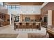 Open kitchen featuring a large island with seating, stainless steel appliances, and custom cabinetry at 11707 Discovery Canyon Dr, Las Vegas, NV 89135