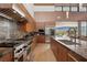 Well-appointed kitchen with stainless steel appliances, a center island, and scenic views at 11707 Discovery Canyon Dr, Las Vegas, NV 89135