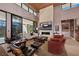 Hardwood living room featuring a fireplace and large windows, great for natural light and nice views at 11707 Discovery Canyon Dr, Las Vegas, NV 89135