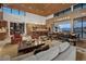 Open floor plan featuring a spacious living room and kitchen with bar-style seating, perfect for entertaining guests at 11707 Discovery Canyon Dr, Las Vegas, NV 89135