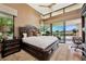 The main bedroom boasts floor to ceiling windows with clerestory, an area rug and exterior views at 11707 Discovery Canyon Dr, Las Vegas, NV 89135