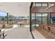 Expansive outdoor patio with dining and lounging areas, barbecue, and seamless indoor-outdoor transition at 11707 Discovery Canyon Dr, Las Vegas, NV 89135