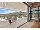 Expansive covered patio featuring luxurious outdoor seating and desert views at 11707 Discovery Canyon Dr, Las Vegas, NV 89135