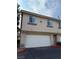 This home features a two car garage, and is painted in neutral colors at 1201 Dusty Creek St, Las Vegas, NV 89128
