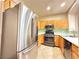 Well-equipped kitchen with stainless steel appliances, plenty of cabinets, and stylish backsplash at 1201 Dusty Creek St, Las Vegas, NV 89128