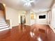 Spacious living room with hardwood floors and an open floor plan to the kitchen at 1201 Dusty Creek St, Las Vegas, NV 89128