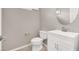 A half bathroom features a modern vanity with chrome fixtures and neutral wall paint at 176 Jay Porter Ave, Henderson, NV 89002