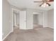 Bedroom boasts a ceiling fan, carpeted floors, mirrored closet and a connecting open doorway at 176 Jay Porter Ave, Henderson, NV 89002
