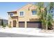 Two-story home features desert landscaping, a two-car garage, and a charming entrance at 176 Jay Porter Ave, Henderson, NV 89002