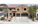 Charming two-story home featuring a two-car garage and well-manicured front yard at 176 Jay Porter Ave, Henderson, NV 89002