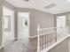 A carpeted hallway upstairs showcasing natural light and well-maintained interiors at 176 Jay Porter Ave, Henderson, NV 89002