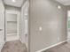 Hallway leads to walk-in closet and bathroom with tiled floors and neutral walls at 176 Jay Porter Ave, Henderson, NV 89002