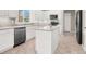 Bright kitchen features stainless steel appliances, white cabinetry, and a functional center island at 176 Jay Porter Ave, Henderson, NV 89002