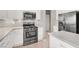 This open kitchen is equipped with stainless steel appliances and ample countertop space at 176 Jay Porter Ave, Henderson, NV 89002