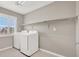 Laundry room features new appliances, ample shelving and a window for natural light at 176 Jay Porter Ave, Henderson, NV 89002