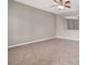 Spacious living room with tile flooring, natural light, and a modern ceiling fan at 176 Jay Porter Ave, Henderson, NV 89002