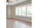 This living room has tile floors, large windows, and a ceiling fan at 176 Jay Porter Ave, Henderson, NV 89002