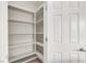 Spacious pantry with ample shelving for organized storage, enhancing functionality at 176 Jay Porter Ave, Henderson, NV 89002