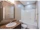 Bathroom vanity features granite countertops, single sink, and a tub-shower combo at 1794 Morro Vista Dr, Las Vegas, NV 89135