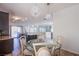 Dining room features a glass table and decorative chandeliers at 1794 Morro Vista Dr, Las Vegas, NV 89135