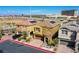 Two-story home with a tile roof and solar panels, complemented by a well-maintained, landscaped yard at 1794 Morro Vista Dr, Las Vegas, NV 89135