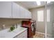 Convenient laundry room with modern appliances, ample storage, and sink at 1794 Morro Vista Dr, Las Vegas, NV 89135
