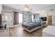 Bedroom features mirrors and a ceiling fan at 1794 Morro Vista Dr, Las Vegas, NV 89135