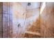 Tiled shower featuring built in bench and rainfall shower head at 1794 Morro Vista Dr, Las Vegas, NV 89135