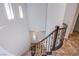 View from top of curved staircase showcasing a chandelier, white walls, and the home's entry at 1794 Morro Vista Dr, Las Vegas, NV 89135