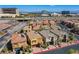 Street view with multiple two-story homes featuring tile roofs, solar panels, and well-kept front yards at 1794 Morro Vista Dr, Las Vegas, NV 89135