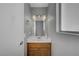 Updated half bath with wood vanity and modern fixtures at 1809 Solana Del Norte Way, North Las Vegas, NV 89031