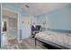 A spacious bedroom with light blue walls, a closet, and a cozy bed, creating a relaxing retreat at 1809 Solana Del Norte Way, North Las Vegas, NV 89031
