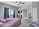 Bedroom with vaulted ceilings, a ceiling fan, and a mounted TV at 1809 Solana Del Norte Way, North Las Vegas, NV 89031