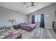 Bedroom with vaulted ceilings, a ceiling fan, and a window with natural light at 1809 Solana Del Norte Way, North Las Vegas, NV 89031