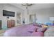 Bedroom with vaulted ceilings, a ceiling fan, and two entries in view at 1809 Solana Del Norte Way, North Las Vegas, NV 89031