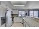 Bright kitchen featuring stainless steel appliances and granite countertops at 1809 Solana Del Norte Way, North Las Vegas, NV 89031