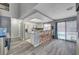 Bright kitchen features stainless steel appliances, granite countertops, and access to the pool area at 1809 Solana Del Norte Way, North Las Vegas, NV 89031