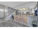 This kitchen features a breakfast bar with seating and stainless steel appliances at 1809 Solana Del Norte Way, North Las Vegas, NV 89031