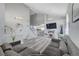 Inviting living room featuring vaulted ceilings, hardwood floors, fireplace, and comfortable seating at 1809 Solana Del Norte Way, North Las Vegas, NV 89031