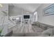 Comfortable living room with vaulted ceilings, hardwood floors, fireplace, and cozy seating arrangement at 1809 Solana Del Norte Way, North Las Vegas, NV 89031